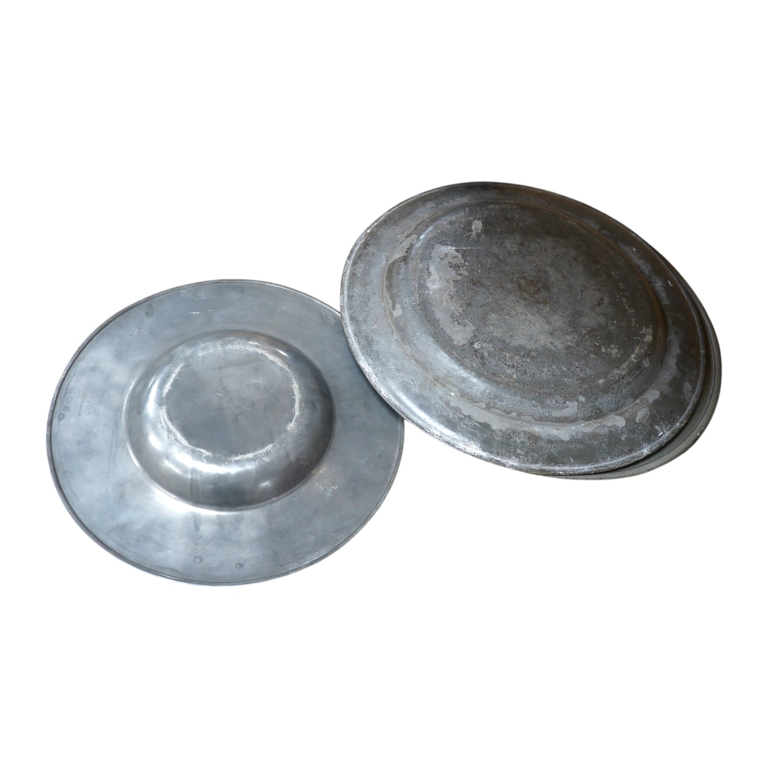 Three pewter chargers, a London touch mark to one, another with rubbed touch marks and ‘WRM’, and another with remains of a touch mark, largest 42.5cm diameter. Condition - fair, worn with damage to one